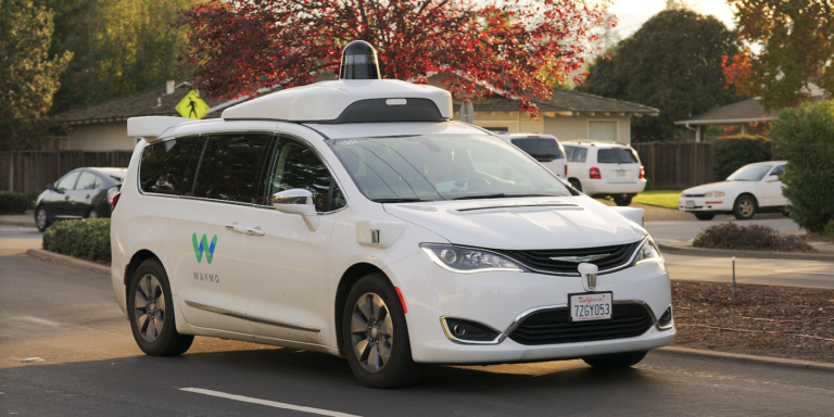 An autonomous Waymo Chrysler Pacifica Hybrid minivan undergoing testing in Los Altos, California