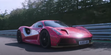 the lotus evija being driven at the hethel test track