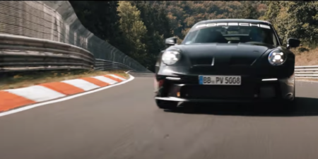 The 2022 porsche 911 gt3 driving at the nurburgring race circuit