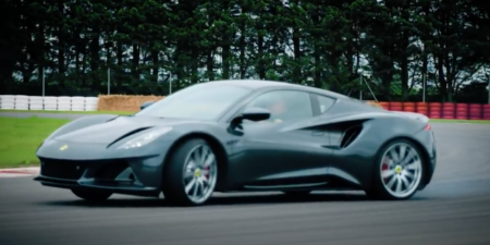 A V6 First Edition Lotus Emira being driven sideways on a racetrack