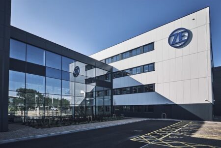 Jake Morris appointed as site leader for ZF’s UK R&D hub Modern white and grey ZF technical centre building with glass entrance and ZF logo, showing contemporary industrial architecture
