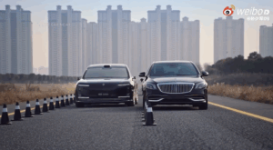 The Maextro S800 and Maybach S680 being driven down a highway with a Chinese cityscape in the background