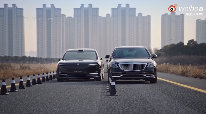 Suspension and steering challenge: Maextro S800 vs Maybach S680 The Maextro S800 and Maybach S680 being driven down a highway with a Chinese cityscape in the background