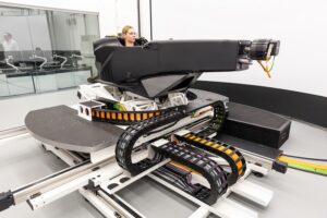IAAPS brings in DiL simulator for dynamics and propulsion development A female using the Ansible Motion Delta S2 simulator in a test laboratory